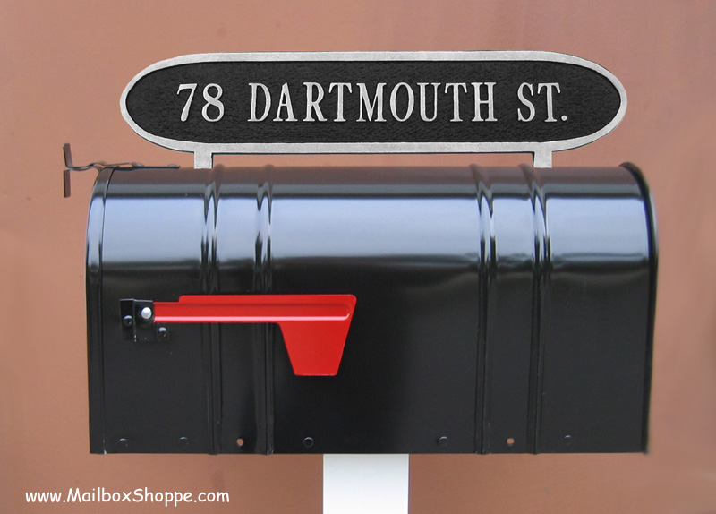 Black mailbox sign with reflective numbers 